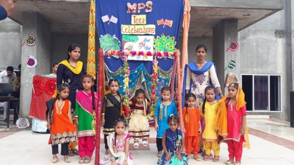 Marigold little girls Enjoying the Teej festival 